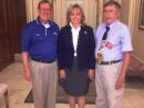 Flanking Oklahoma Gov Mary Fallin are Oklahoma Section PIC Michael Dean, K5MFD, and Section Manager Lloyd Colston, KC5FM, following the signing of Oklahoma's proclamation.